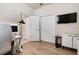 Spacious office with wood-look floors, closet space, and a modern desk setup at 6560 Willowshire Way, Bradenton, FL 34212