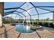 Screened-in pool and spa with brick patio offer views of the water; great for outdoor living at 6560 Willowshire Way, Bradenton, FL 34212