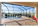 Screened in pool and spa offers a relaxing outdoor retreat with views of the pond at 6560 Willowshire Way, Bradenton, FL 34212