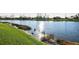 Picturesque waterfront views from the lush backyard, offering a serene and natural setting at 6560 Willowshire Way, Bradenton, FL 34212
