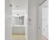 Bathroom featuring double sink vanity, tile flooring, and enclosed shower at 6639 Pineview Ter # 6639, Bradenton, FL 34203