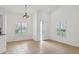 Bright, airy living room with tile flooring, shuttered windows, and recessed lighting at 6639 Pineview Ter # 6639, Bradenton, FL 34203