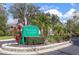 Well-maintained community entrance sign surrounded by lush landscaping at 6639 Pineview Ter # 6639, Bradenton, FL 34203