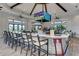 Stylish bar area inside the community center with ample seating, perfect for socializing and enjoying refreshments at 7140 Woodville Cv, Bradenton, FL 34202