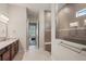 Modern bathroom featuring a large glass shower, tile backsplash, and doorway to bedroom at 7140 Woodville Cv, Bradenton, FL 34202