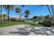 A backyard oasis, where lush greenery meets the tranquil waterfront, perfect for relaxation at 732 Siesta Dr, Sarasota, FL 34242