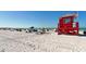 Lifeguard station on a lively beach, surrounded by beachgoers enjoying a sunny day at 732 Siesta Dr, Sarasota, FL 34242