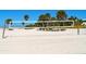 Volleyball net at the beach near benches and palm trees at 732 Siesta Dr, Sarasota, FL 34242