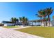 A modern building complex with multiple covered outside areas and a tiled walkway at 732 Siesta Dr, Sarasota, FL 34242