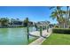 Waterfront property featuring a private dock and boat lift, providing convenient access to boating and water activities at 732 Siesta Dr, Sarasota, FL 34242