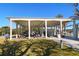 Open-air pavilion with picnic tables and shade, perfect for gatherings near the beach at 732 Siesta Dr, Sarasota, FL 34242