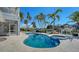 Features a kidney-shaped pool and a hot tub with serene waterfront views at 732 Siesta Dr, Sarasota, FL 34242