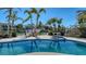 Luxurious pool and spa overlooking a private boat dock and serene waterfront views at 732 Siesta Dr, Sarasota, FL 34242