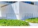 Siesta Beach modern landmark featuring greenery with engraved sign, reflecting community pride at 732 Siesta Dr, Sarasota, FL 34242
