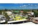 Charming Siesta Village view with colorful buildings and lush greenery at 732 Siesta Dr, Sarasota, FL 34242