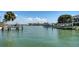 Scenic water view showcasing multiple boat docks and beautiful waterfront properties under a bright sky at 732 Siesta Dr, Sarasota, FL 34242