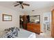 Bedroom with tile flooring, a ceiling fan, and attached ensuite bathroom at 747 Sunset Dr, Tarpon Springs, FL 34689