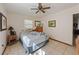 Bedroom with neutral walls, tile flooring, and a ceiling fan at 747 Sunset Dr, Tarpon Springs, FL 34689