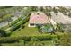 Overhead view of a screened-in pool, manicured yard, and a meticulously kept clay tile roof in a beautiful neighborhood at 7649 Quinto Dr, Sarasota, FL 34238
