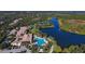Beautiful aerial view showcasing the community's amenities, including pools, lakes, tennis courts, and lush landscaping at 7649 Quinto Dr, Sarasota, FL 34238