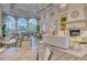 Bright clubhouse featuring large windows, ample seating, and cozy fireplace with beautiful decor at 7649 Quinto Dr, Sarasota, FL 34238