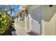 Charming front entry features a bright white door with elegant trim and a neatly landscaped walkway at 7649 Quinto Dr, Sarasota, FL 34238