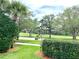 A picturesque view of green space featuring mature trees, lush landscaping, and a serene environment at 7649 Quinto Dr, Sarasota, FL 34238