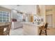 Bright kitchen featuring white cabinets, tile floors, and an eating bar with bar stool seating at 7649 Quinto Dr, Sarasota, FL 34238