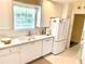 Well-lit kitchen featuring a white sink, ample counter space, and modern appliances at 7649 Quinto Dr, Sarasota, FL 34238