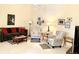 Cozy living room featuring a comfortable sofa, armchairs, and neutral decor with ample natural light at 7649 Quinto Dr, Sarasota, FL 34238