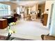 Open-concept living area with views of a well-equipped kitchen and adjacent dining space at 7649 Quinto Dr, Sarasota, FL 34238