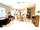 Open concept living area, adjacent kitchen, dining area with natural light and neutral color palette at 7649 Quinto Dr, Sarasota, FL 34238