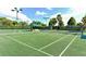 Well-maintained tennis court with lighting, perfect for evening matches and outdoor fun at 7649 Quinto Dr, Sarasota, FL 34238