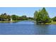 Scenic water view highlighting lush greenery, mature trees, and calm water, perfect for relaxing in nature at 7649 Quinto Dr, Sarasota, FL 34238