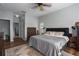 Spacious bedroom with wood floors, neutral paint and comfortable queen sized bed at 7951 113Th Avenue E Cir, Parrish, FL 34219