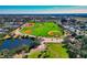 Aerial view of a neighborhood with a large sports complex and pond at 8404 43Rd W Ave, Bradenton, FL 34209