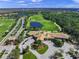Aerial view of a clubhouse with a golf course and scenic views at 8956 Stone Harbour Loop, Bradenton, FL 34212