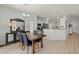 Open dining area with wood floors, adjacent to kitchen for easy access at 8956 Stone Harbour Loop, Bradenton, FL 34212