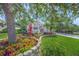 Beautiful home exterior with lush landscaping and a well-maintained lawn, creating an inviting curb appeal at 8956 Stone Harbour Loop, Bradenton, FL 34212