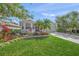 Charming single-story home with well-manicured lawn, flower beds, and mature landscaping at 8956 Stone Harbour Loop, Bradenton, FL 34212