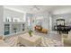 Open-concept living room with built-in shelving, fireplace, and ample natural light at 8956 Stone Harbour Loop, Bradenton, FL 34212
