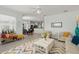 Open-concept living room with view of kitchen and dining area at 8956 Stone Harbour Loop, Bradenton, FL 34212