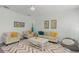 Bright living room with comfortable seating and colorful rug at 8956 Stone Harbour Loop, Bradenton, FL 34212