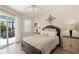 Comfortable main bedroom with a slider to the lanai at 8956 Stone Harbour Loop, Bradenton, FL 34212