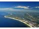 Breathtaking aerial view of the coastline, showcasing the beautiful beach and cityscape at 940 Siesta Key Pl, Sarasota, FL 34242