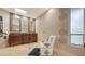 Bright bathroom with double vanities, a cozy chair, and decorative wall art creating a serene ambiance at 940 Siesta Key Pl, Sarasota, FL 34242