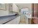 Functional laundry room with built-in cabinets and a washing machine at 940 Siesta Key Pl, Sarasota, FL 34242