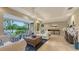 Open living area with stylish furnishings and a seamless transition to the outdoor space at 940 Siesta Key Pl, Sarasota, FL 34242