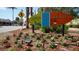 Colorful Siesta Key Village sign surrounded by vibrant flowers at the entrance of the charming village at 940 Siesta Key Pl, Sarasota, FL 34242