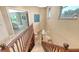 View of the staircase overlooking the lower level and providing access to the upper floor at 940 Siesta Key Pl, Sarasota, FL 34242